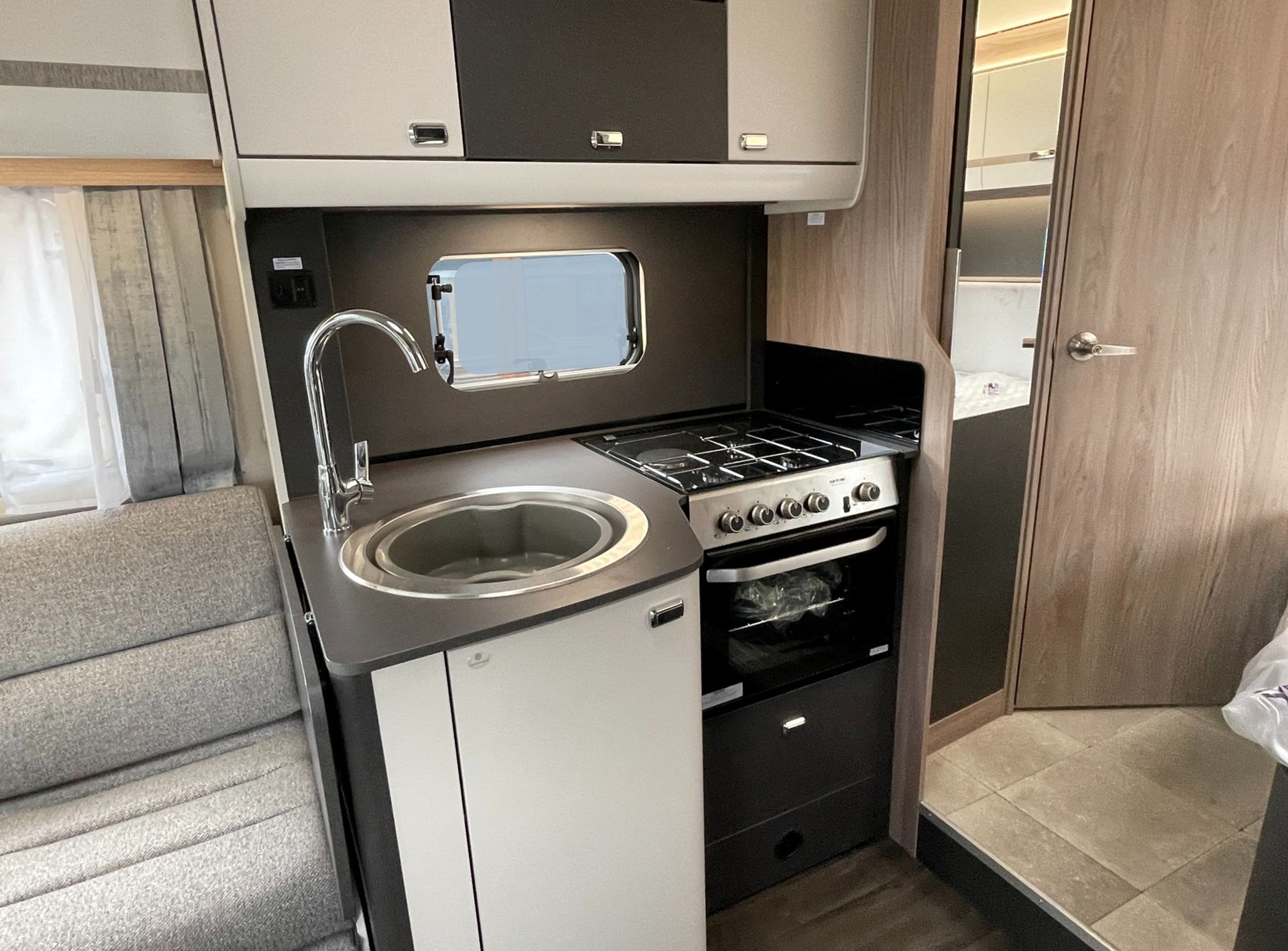 swift voyager 564 4 berth motorhome hire rental for 1 to 4 people, fix rear French bed, perfect for Holiday, kids holidays, Festivals, F1, Silverstone, Glastonbury, touring, travelling, camping, dog, friendly, accommodation, camping, Kitchen, hob, oven, grill, fridge