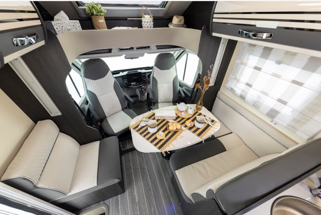 Roller Team Zefiro 685 4 berth motorhome for rental comes with toilet, shower, kitchen, two fixed rear single beds great for holiday, festival, self contained, accommodation, camping, kids holidays, dog friendly,