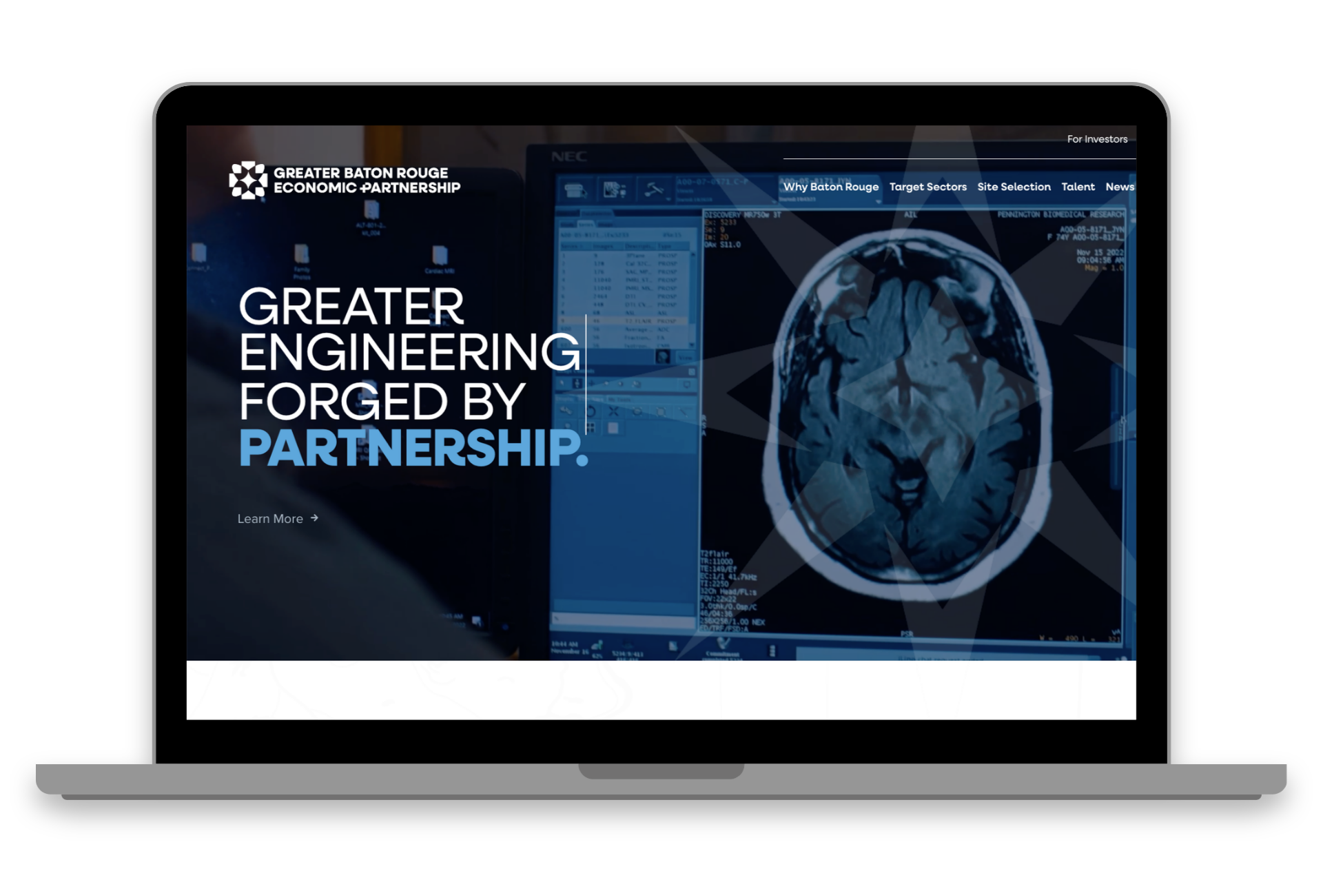 Laptop displaying a medical scan and the text “GREATER ENGINEERING FORGED BY PARTNERSHIP”