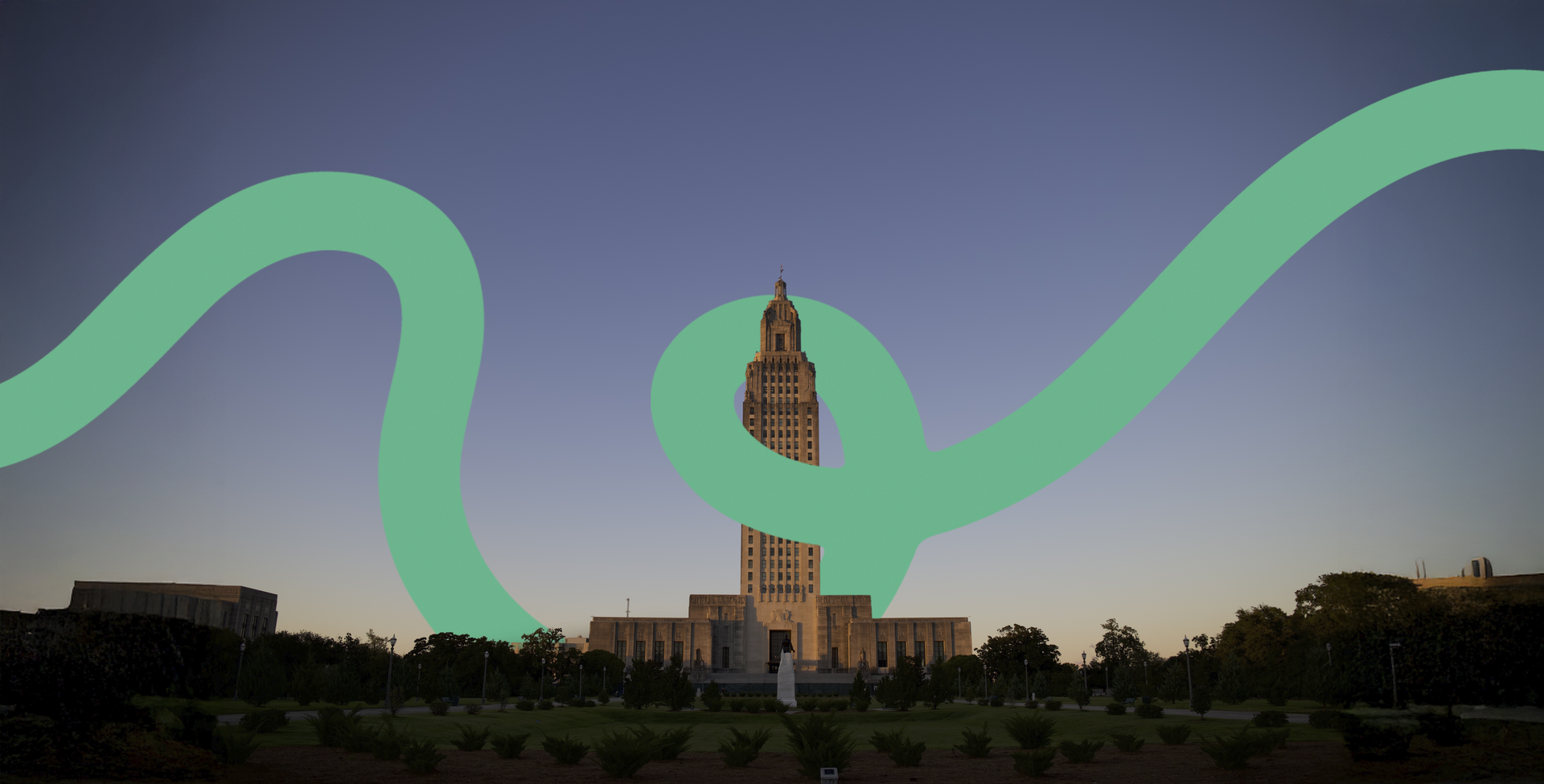 Evening skyline with a tall lit tower and a green ribbon-like light trail across the sky