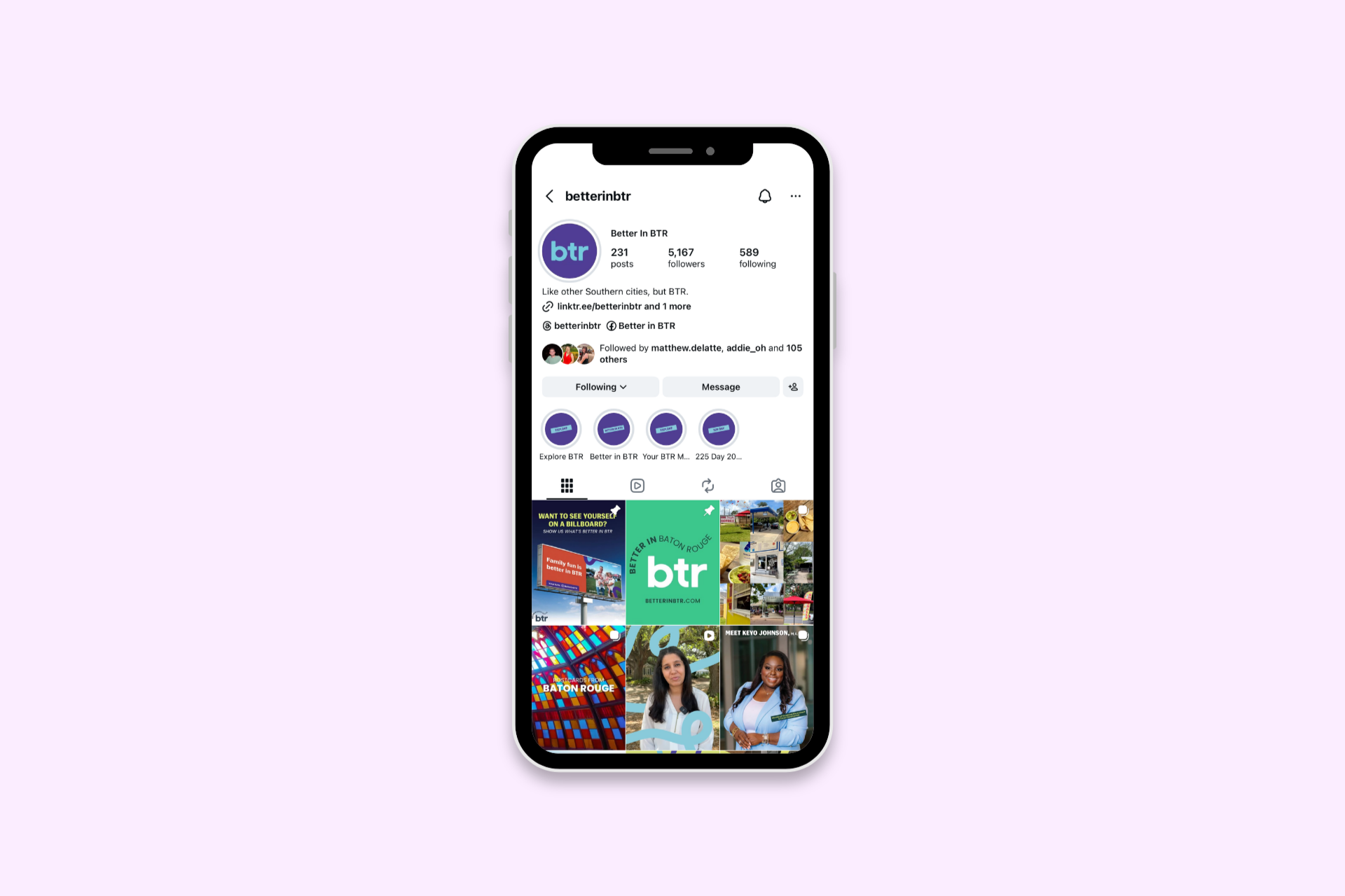 Smartphone showing a social media profile page on a pale pink background