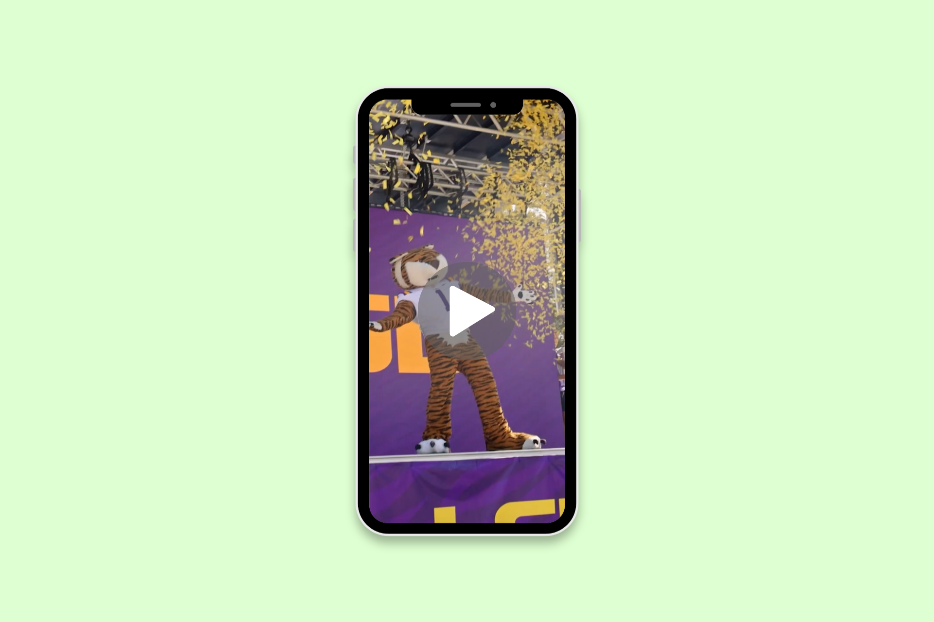 Smartphone screen showing a character on a purple background with a play icon overlay.
