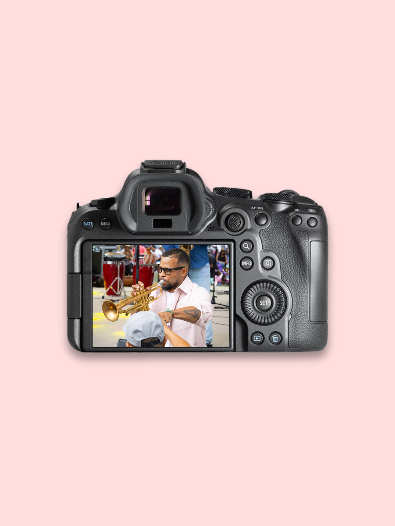 Camera displaying a man on its LCD screen against a pink background