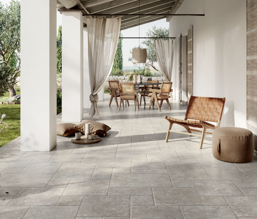Patio With Grey Tiles And Wooden Chairs — Tile Trends in Tweed Heads South, NSW