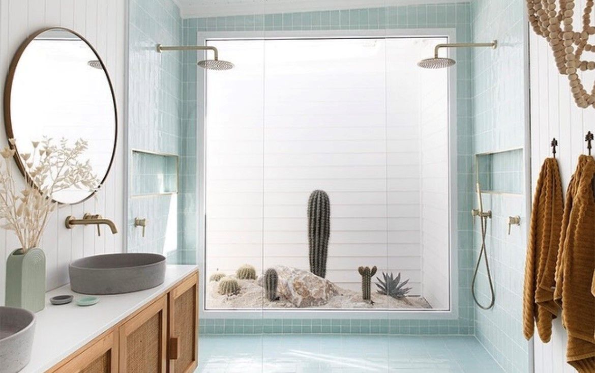 Bathroom with teal tiles, light wood vanity, oval mirror — Tile Trends in Tweed Heads South, NSW