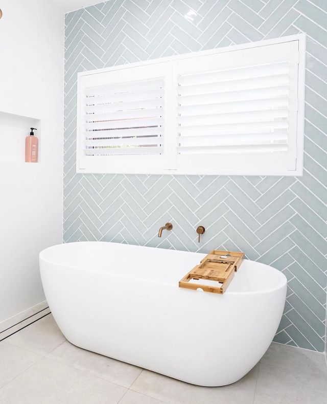 Bathroom With Tub And Blue Casuarina Tiles — Tile Trends in Ballina, NSW
