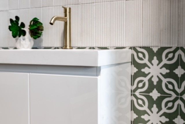 Bathroom With Gold Tap And White And Pattern Wall Tiles — Tile Trends in Tweed Heads South, NSW