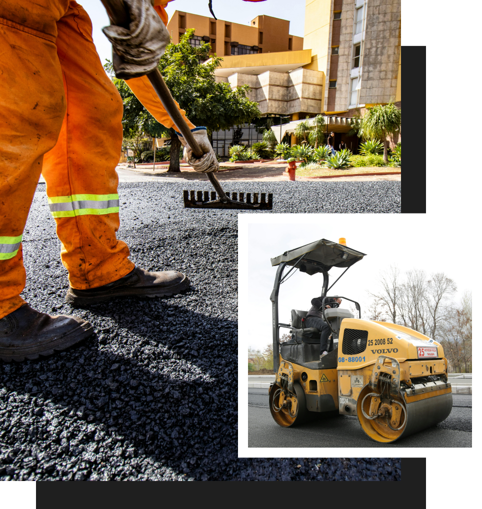 A man in orange pants is using a rake on a road