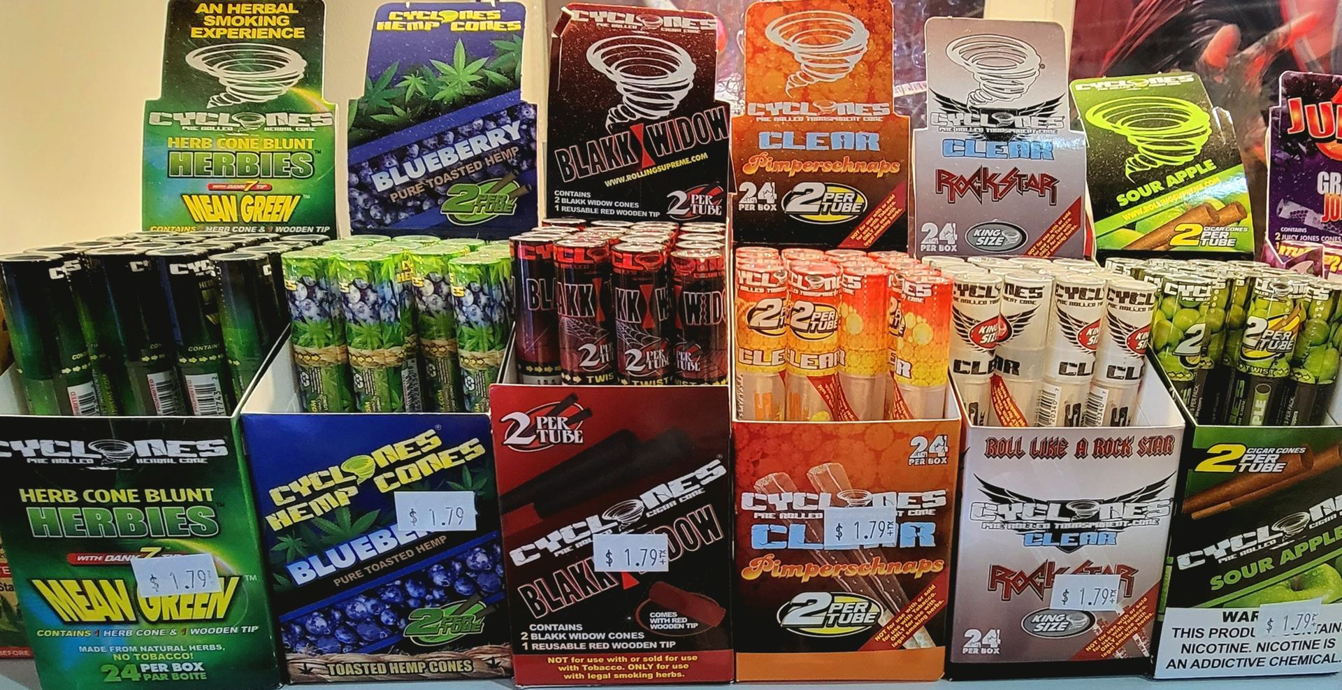 Display of canned cocktails in margarita, lemon drop, and cosmopolitan flavors.