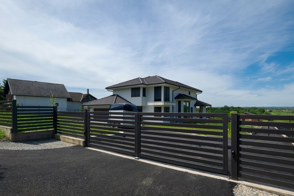 Wooden and stone front gate with fencing, shown in a clean white background product view