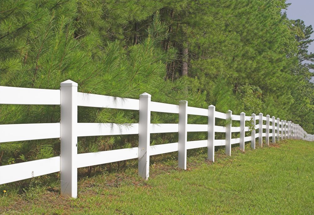 White three-rail fence with corner posts on a plain white background