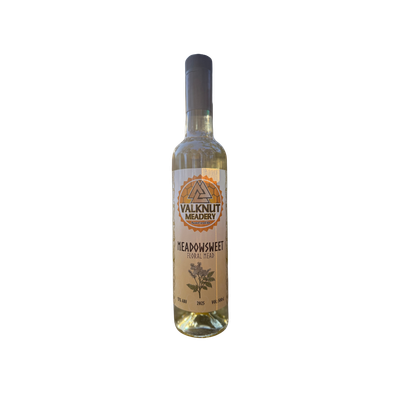 Bottle of Meadowsweet lfloral mead with label, light yellow liquid, standing upright.