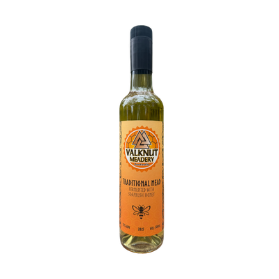 Bottle of traditional mead from Valknut Meadery, with orange and tan label.