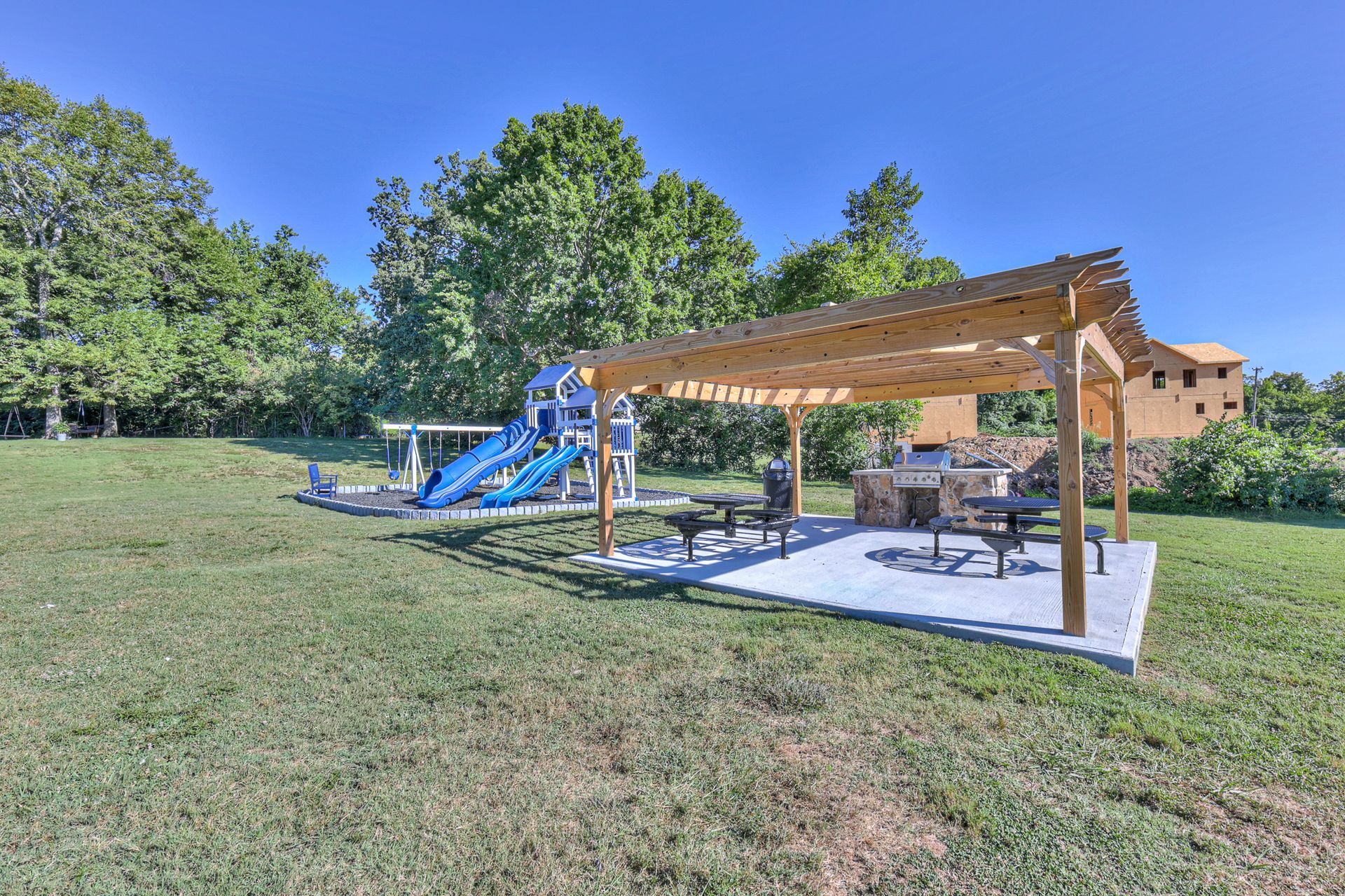 Photo of the playground and community grill area