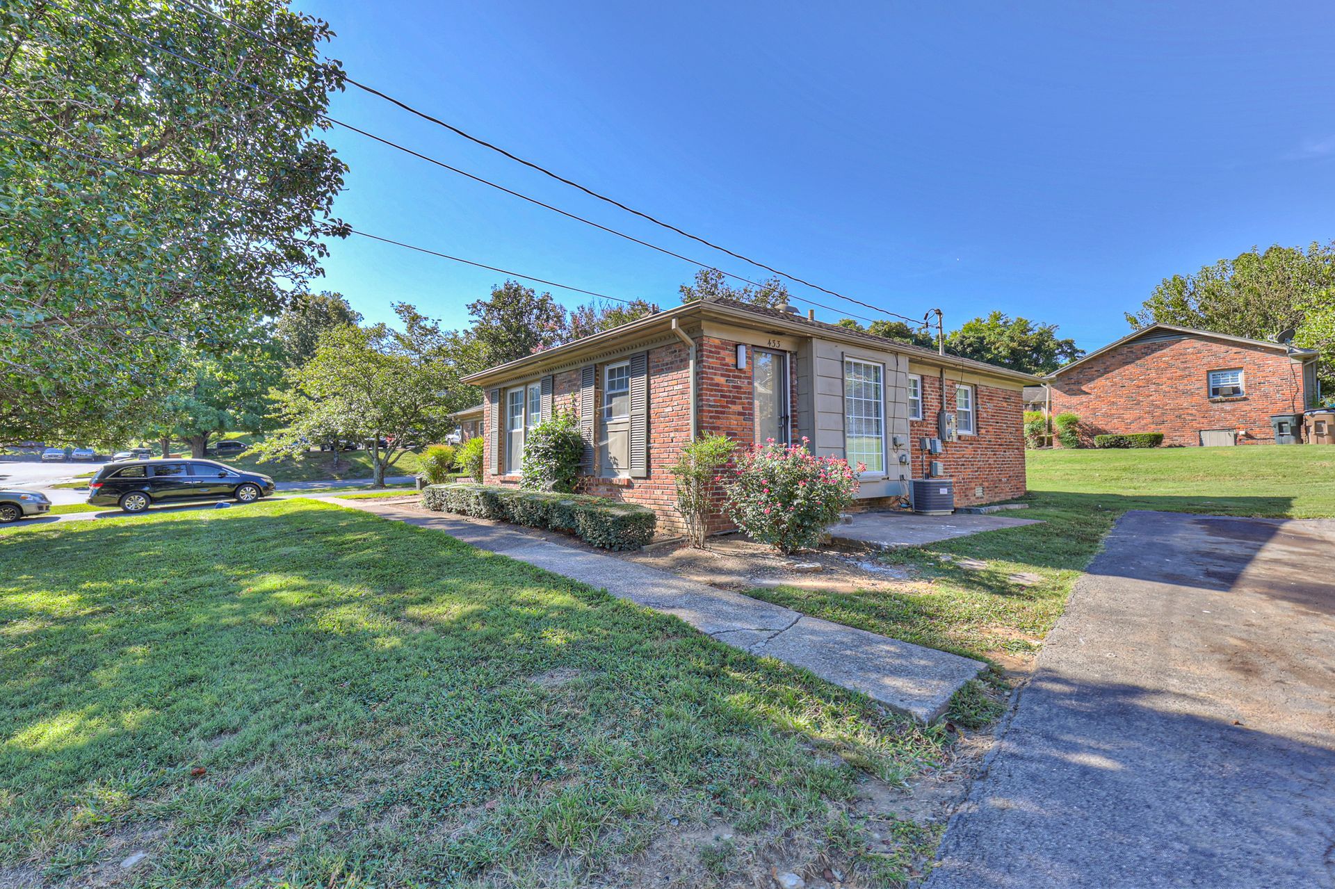 Photo of a single building with plenty of lawn space