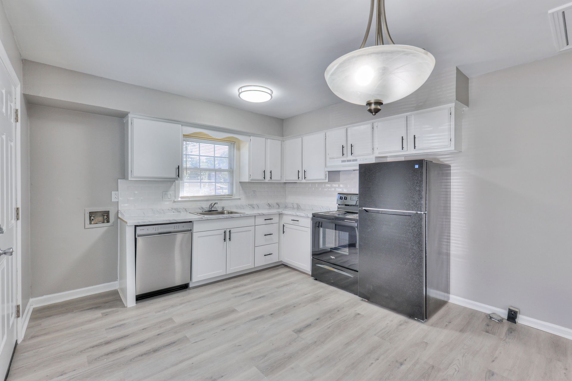 Photo of a kitchen with plenty of cabinetry