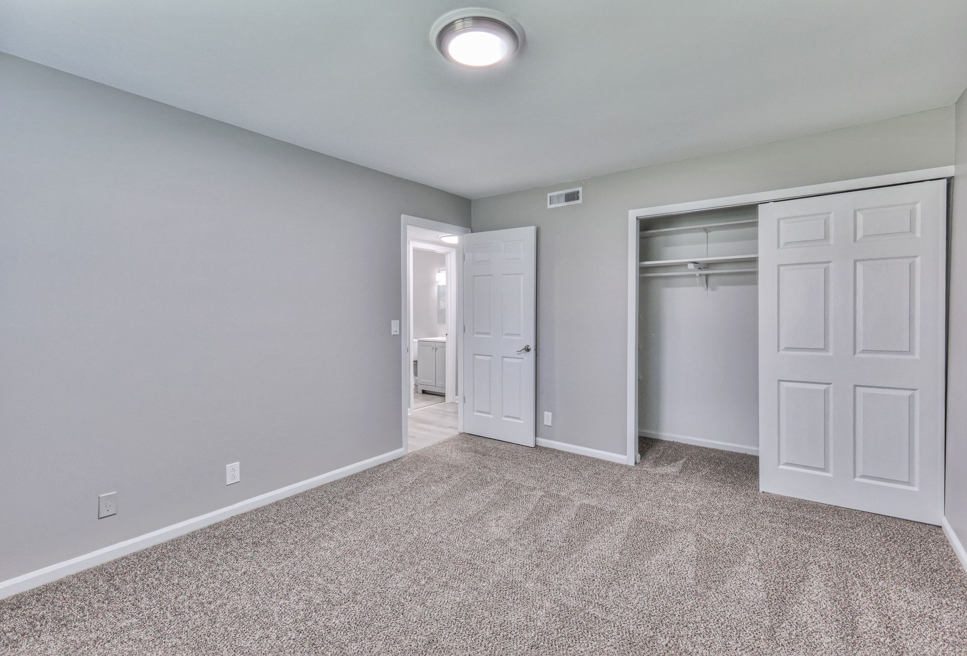 Photo of a carpeted bedroom