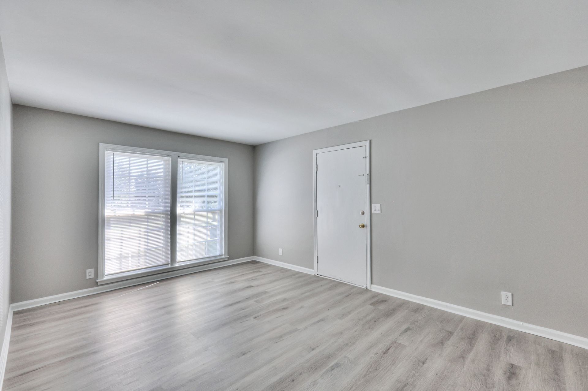 Photo of a living room showing a large window