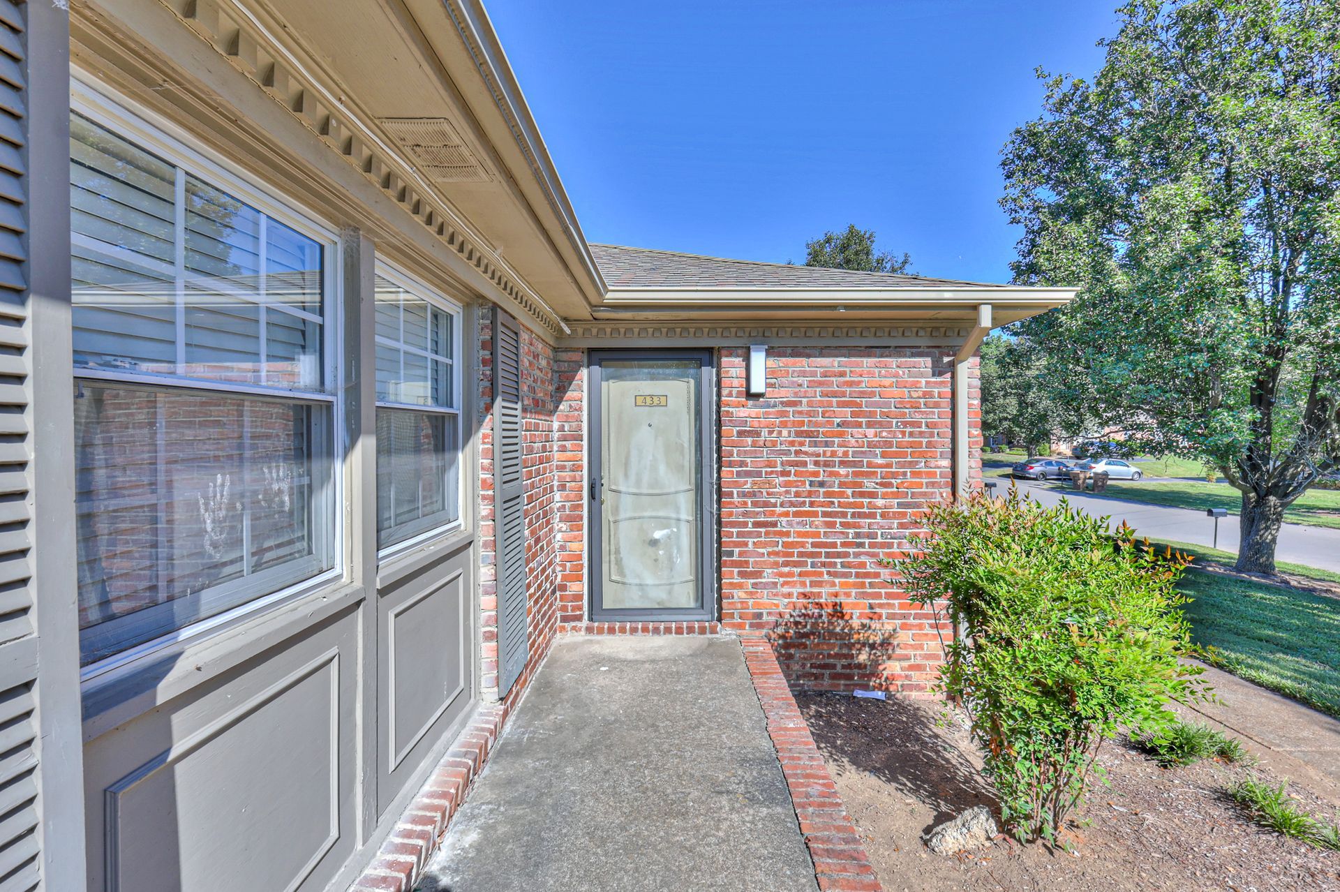 Photo of an entrance to a home on a small porch area