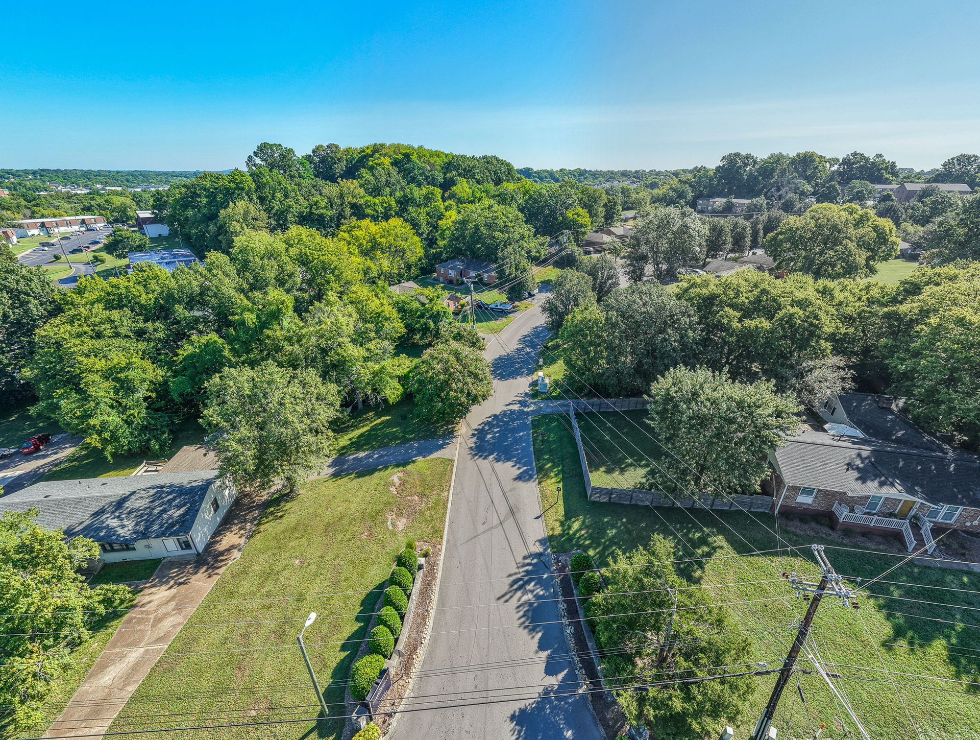 Aerial photo of a road leading to different homes