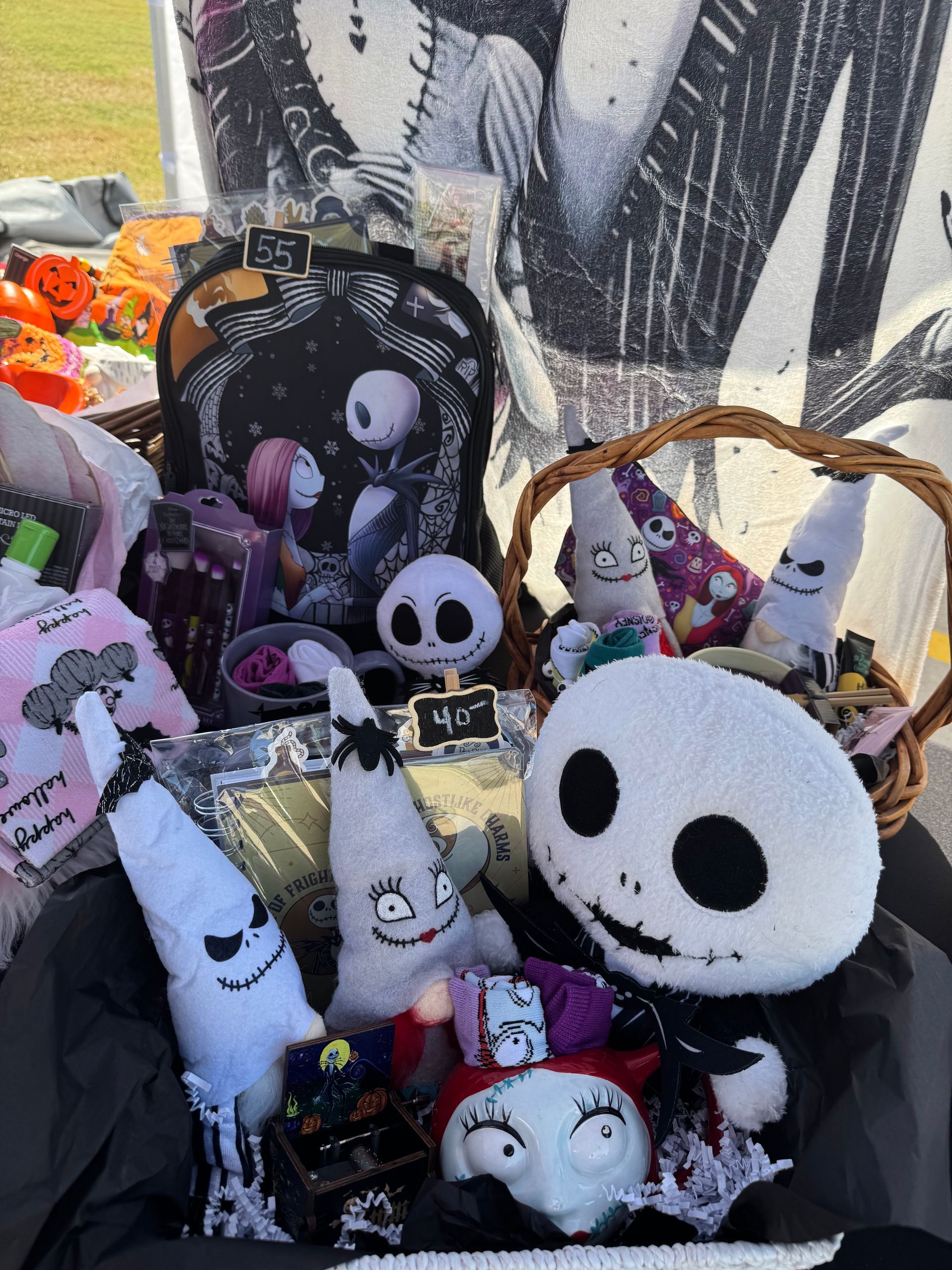 Spooky Nightmare Before Christmas plush dolls in a basket, featuring Jack Skellington and Oogie Boogie.