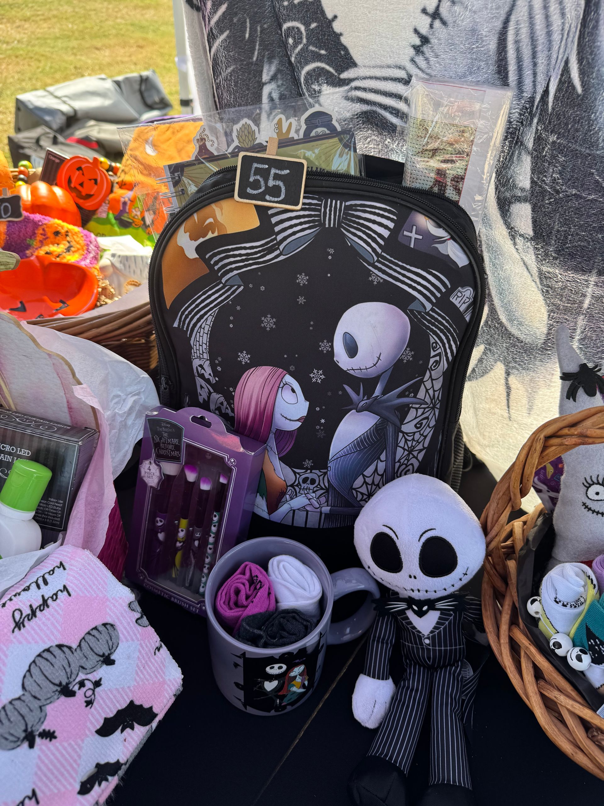Nightmare Before Christmas display with Jack Skellington, Sally, and themed bags and accessories