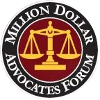 Million Dollar Advocates Forum logo with gold scales on a black circular background