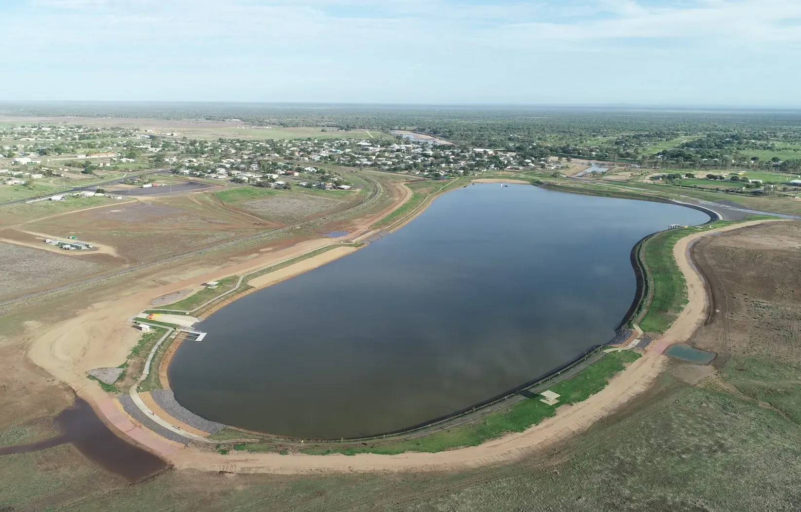 An Aerial View with a Large Water Area Field and a City on the Back | Woree, Queensland | Cheshire Contractors