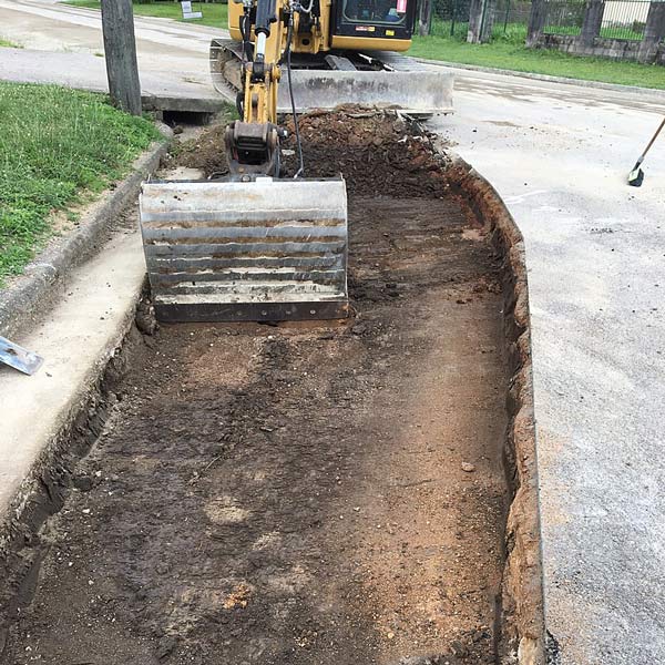 Excavator Bucket at Gort and Fanning Street | Woree, Queensland | Cheshire Contractors