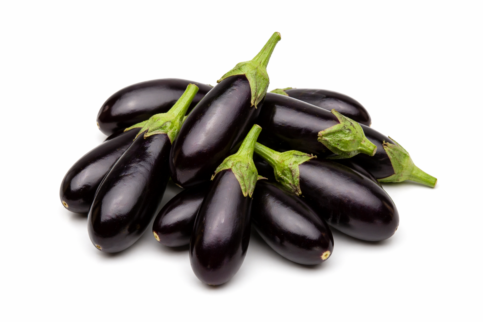 Small glossy aubergines arranged for wholesale catering supply
