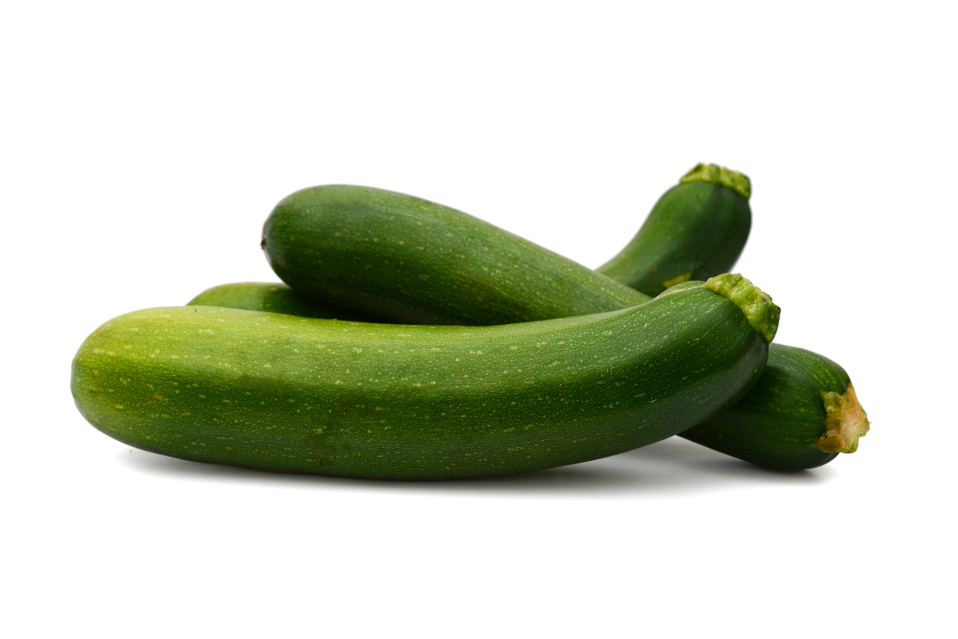 Fresh green courgettes arranged for catering supply