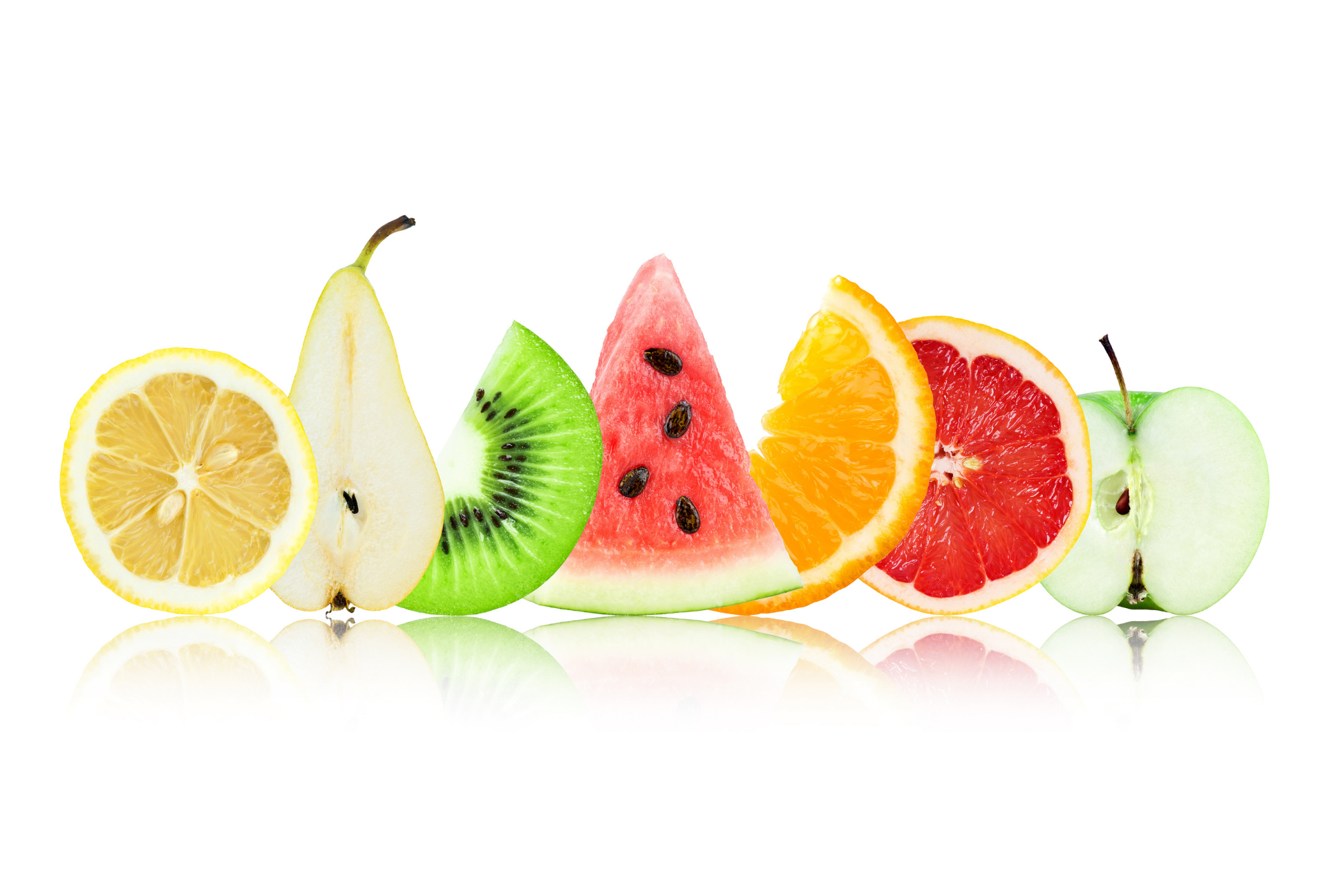 Assorted fresh fruit slices arranged in a colorful row on a white background