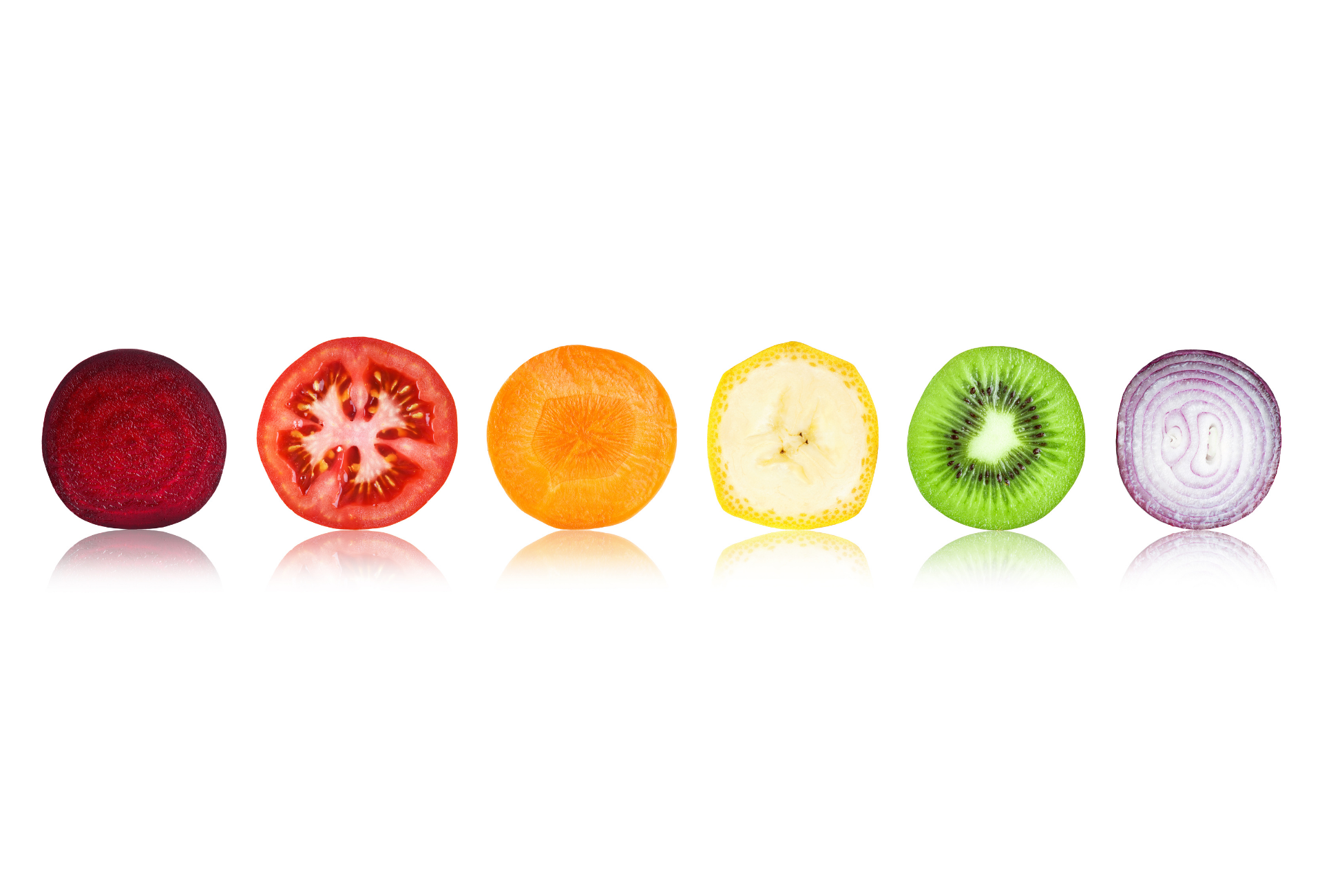 Slices of colorful fruits in a row: strawberry, tomato, orange, lemon, kiwi, and onion on white background