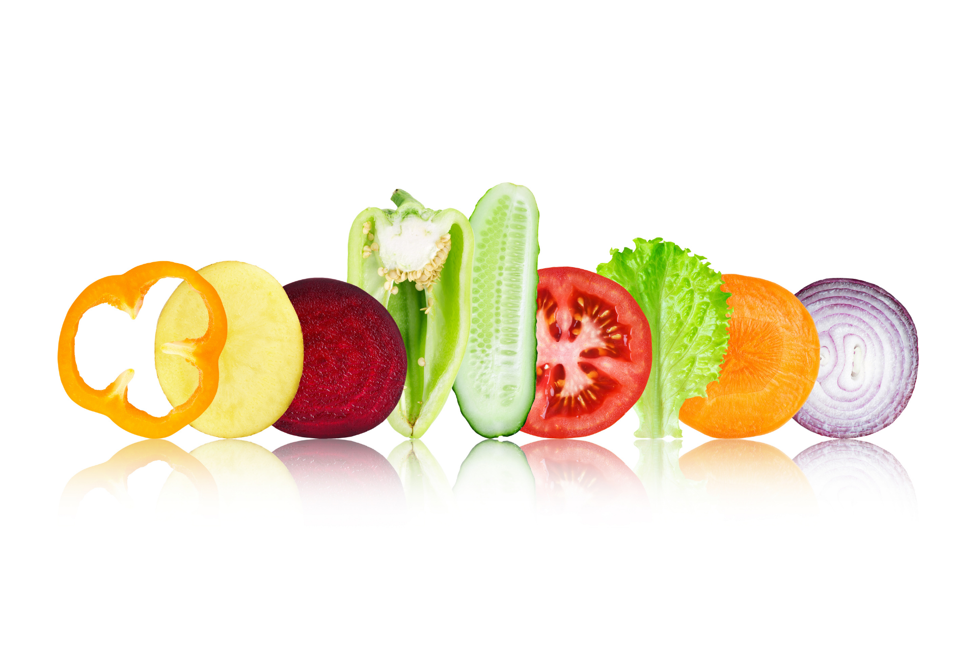 Colorful sliced fruits and vegetables arranged in a row on a white background