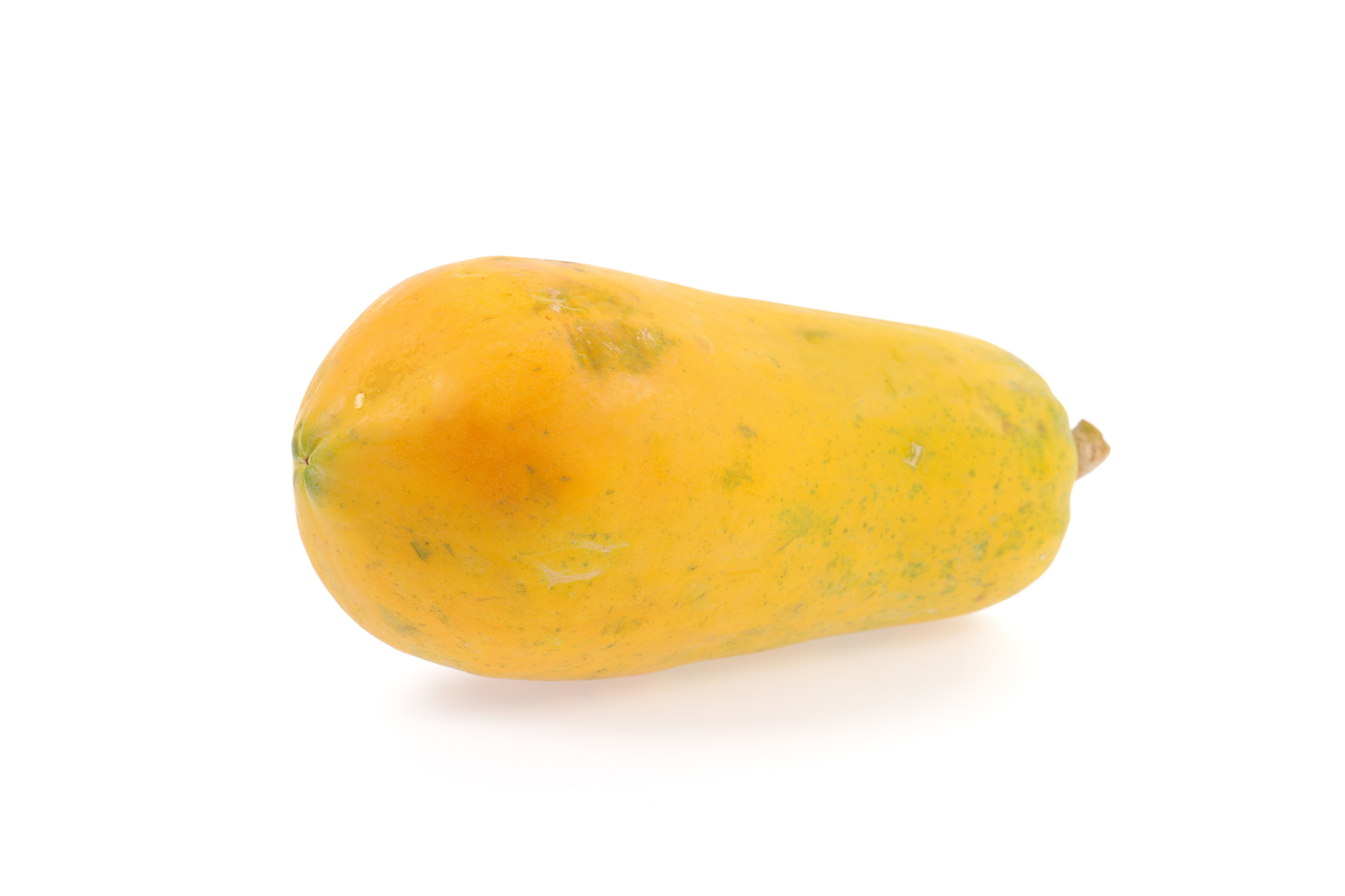 Golden papaya cut to reveal bright orange flesh