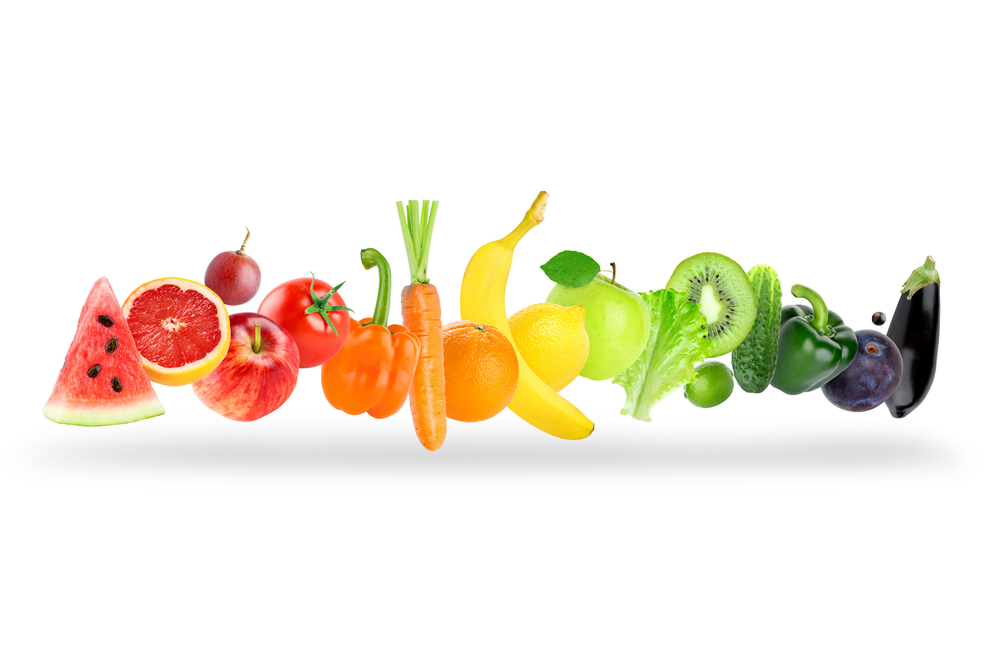 See our Produce Range Colorful fruit arranged in a rainbow from red watermelon to purple grapes on a white background