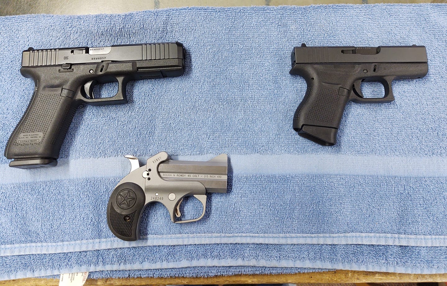 three pistols in different sizes