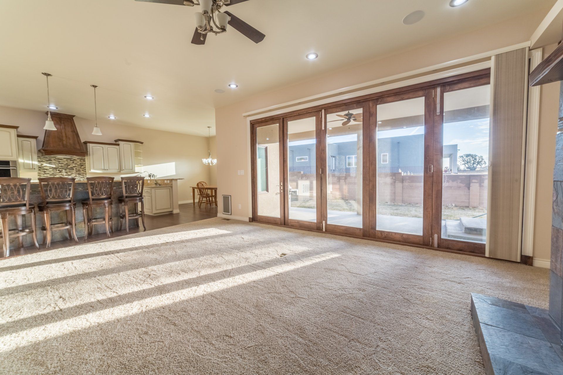 a living room with sliding glass doors installed by Sun Glass