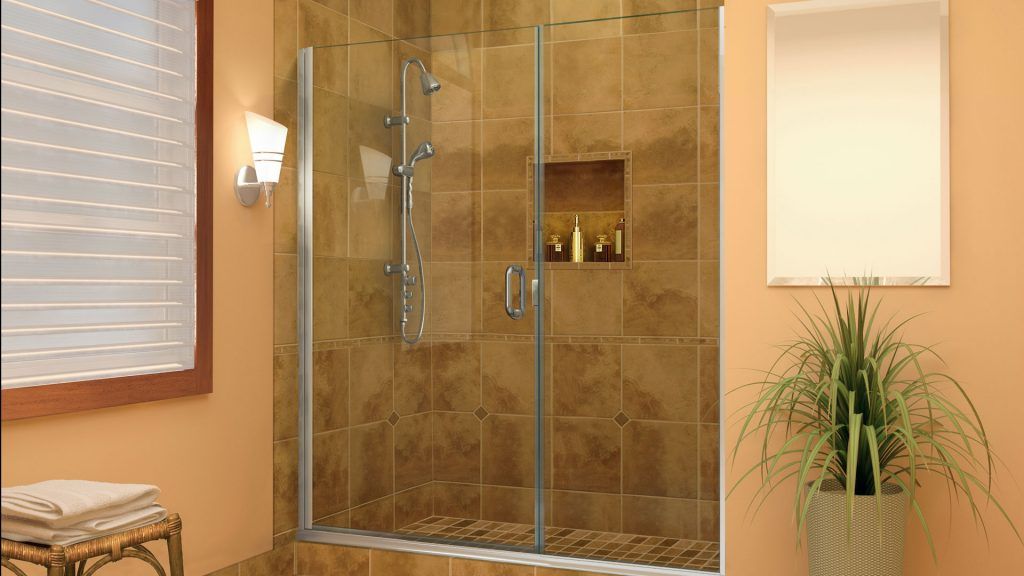 a bathroom with a sliding glass shower door by Sun Glass