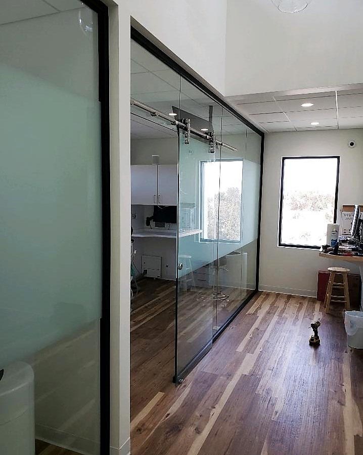 Office space with a glass wall installed by Sun Glass