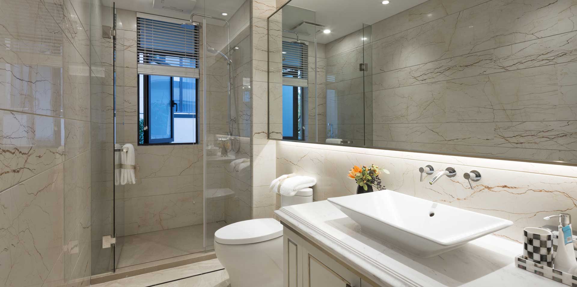 a bathroom with new shower glass door by Sun Glass