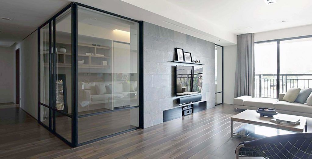 Office area with a glass wall by Sun Glass