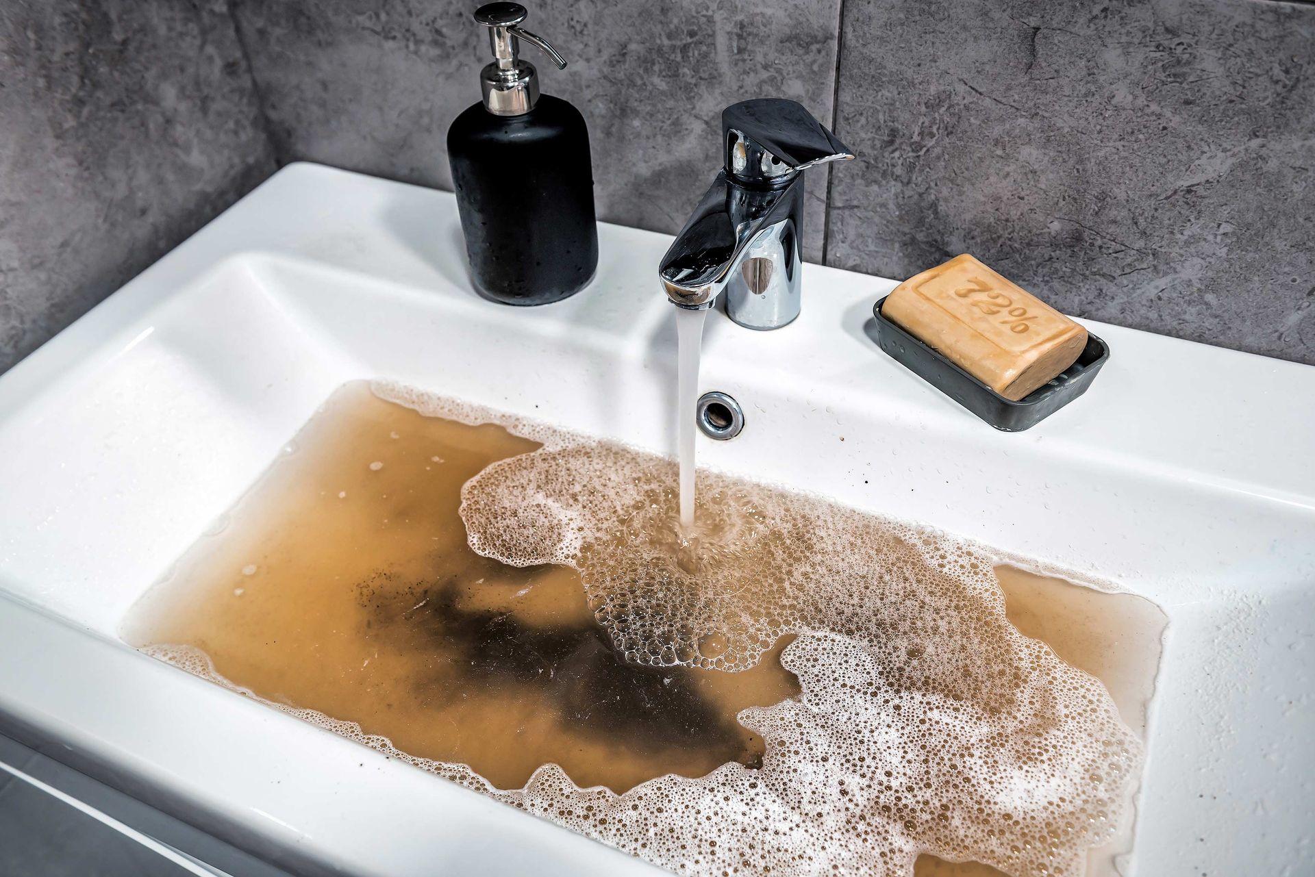 A clogged bathroom sink. A clogged bathroom sink.