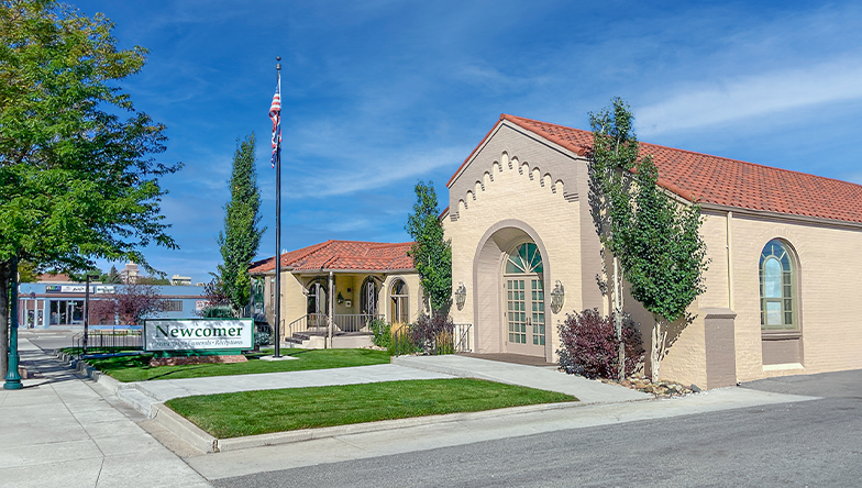A large building with a flag in front of it