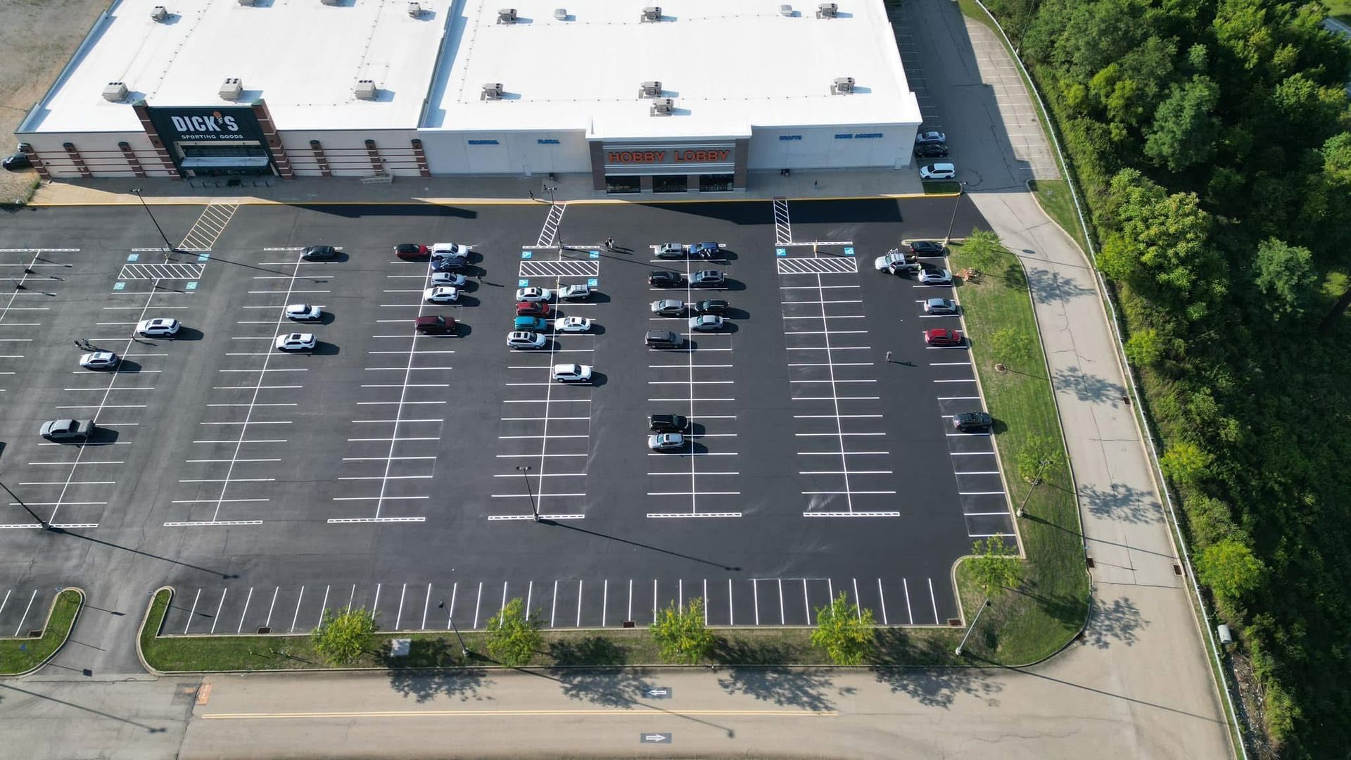 After an aerial view of a parking lot in front of a store.