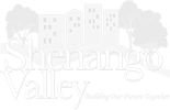 Logo for Shenandoah Valley with faint mountains, trees, and buildings in the background