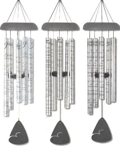 Three hanging wind chimes with clear tubes and black heart-shaped pendants
