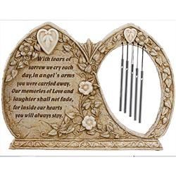 Ornate gold memorial plaque with angel motif, engraved poem, and hanging wind chimes.