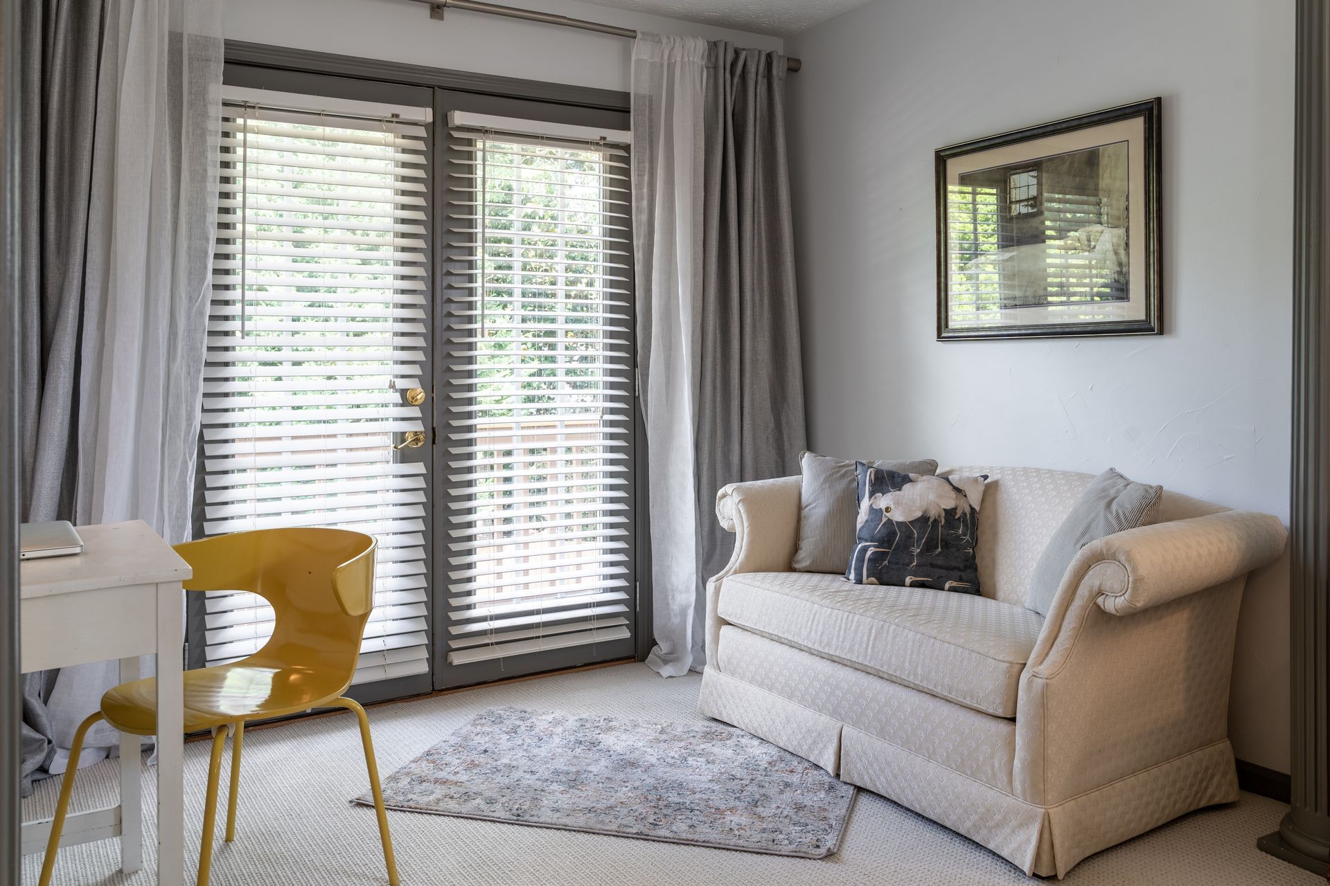 French doors covered by window blinds in a living room near Orlando, FL.