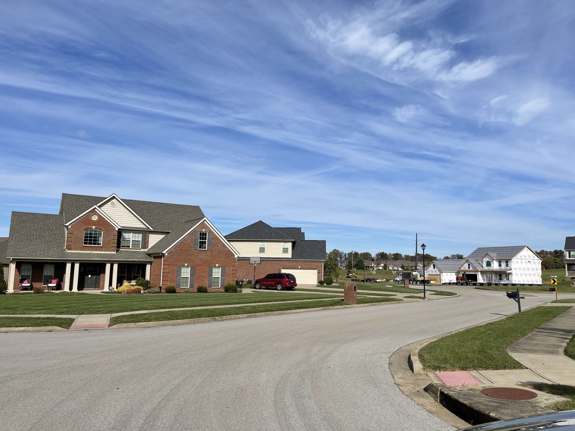 A row of houses in a residential neighborhood on a sunny day
